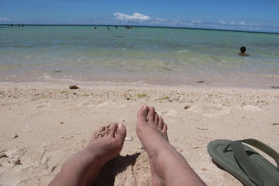 Low section of person on beach