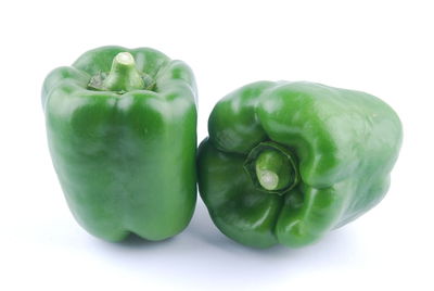 Close-up of green bell pepper against white background