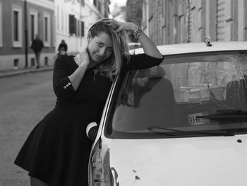 Portrait of young woman in car