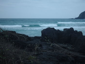 Scenic view of beach and sea against sky