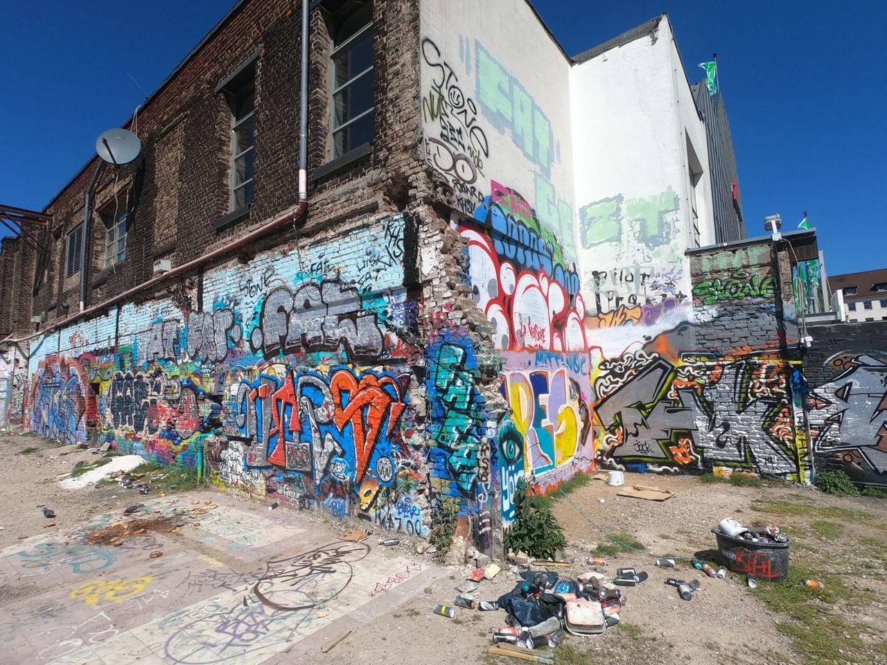 GRAFFITI ON WALL IN CITY AGAINST SKY