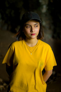 Portrait of beautiful young woman wearing hat