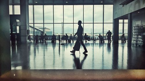 Silhouette people in departure area at milan–malpensa airport