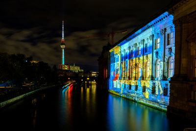 Illuminated buildings in city at night