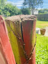 Close-up of wooden fence on field