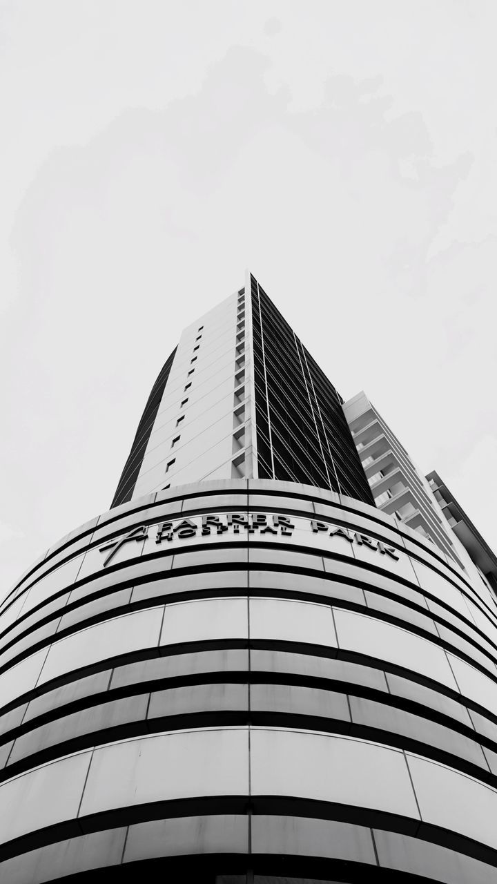 LOW ANGLE VIEW OF MODERN BUILDINGS AGAINST SKY