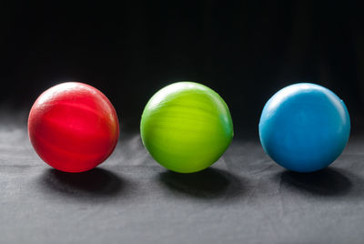 Close-up of multi colored balls on table