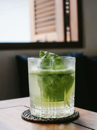 Close-up of cocktail in glass on table