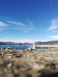 Surface level of land against blue sky