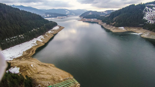 High angle view of lake amidst mountains