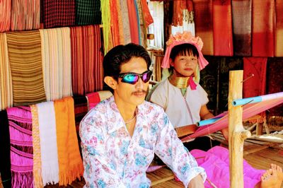 Man and woman sitting at shop