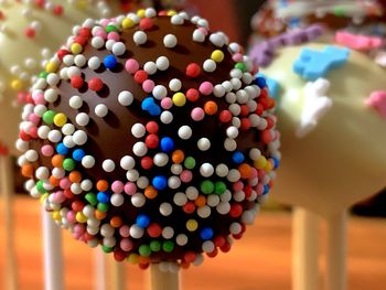 Close-up of multi colored candies on table cake pop
