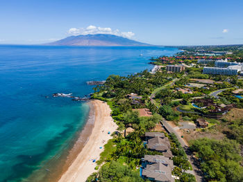 High angle view of sea against blue sky