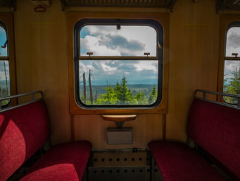 Reflection of clouds in train window