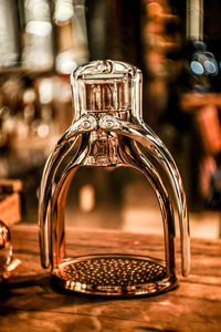 Close-up of illuminated lamp on table