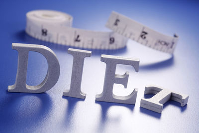 Close-up of information sign on table