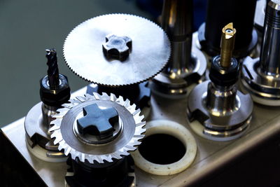 High angle view of machine parts on table