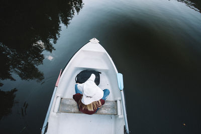 High angle view of man in boat sailing on sea