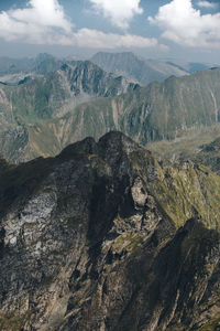 Scenic view of mountains against cloudy sky