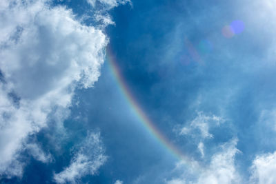 Low angle view of rainbow in sky