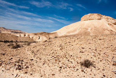 Rock formations in desert against sky