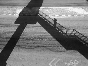 Shadow of people on beach against sky