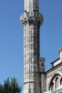 Low angle view of historical building against blue sky