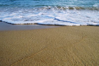 High angle view of surf on beach