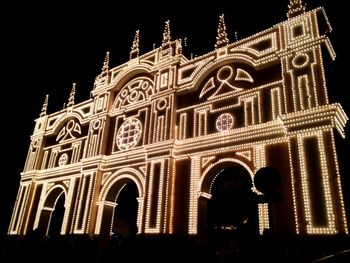 Low angle view of historical building at night