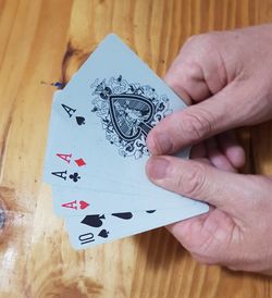 High angle view of person hand on table