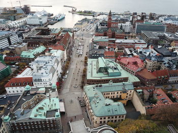 High angle view of crowd on street amidst buildings in city