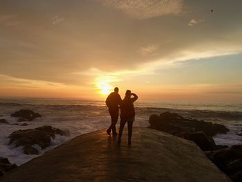 Scenic view of sea at sunset