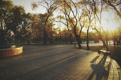 Empty footpath at sunset