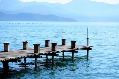 Pier on sea against sky