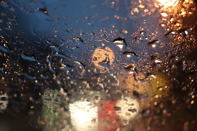 Full frame shot of raindrops on glass window