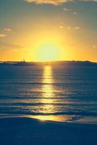 Scenic view of sea against sky at sunset