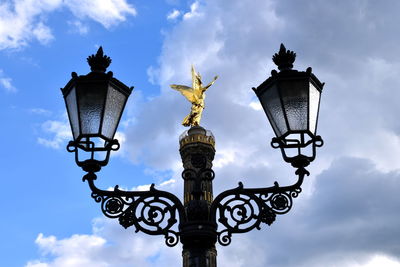 Low angle view of street light against sky