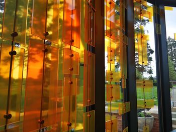 Reflection of illuminated building on glass window