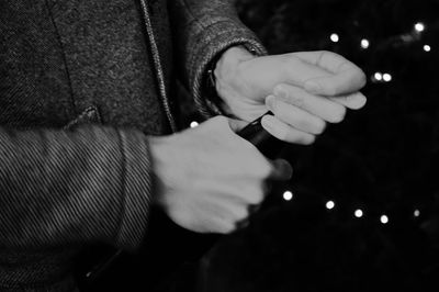 Male hands opening a champagne bottle