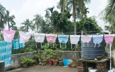 Clothes drying on clothesline against sky