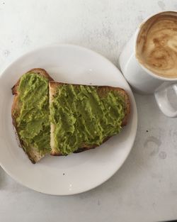 High angle view of avocado toast served on table