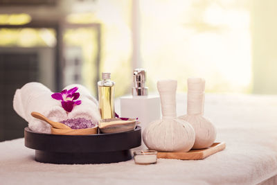 Close-up of spa products on massage table