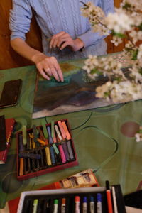 Midsection of woman using mobile phone