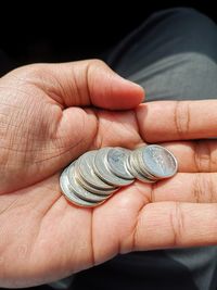 Close-up of hand holding ring