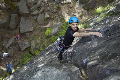 View of rock climber on rock face