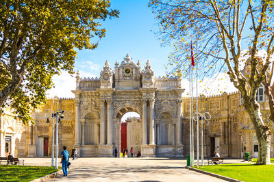 Group of people in front of historic building