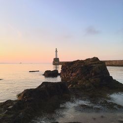 Scenic view of sea against sky at sunset