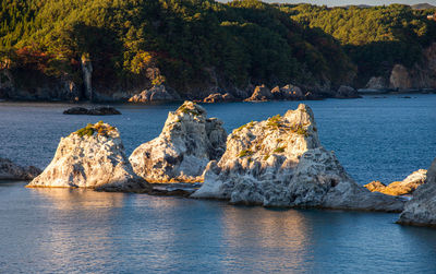 Scenic view of sea against mountain