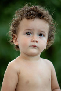 Close-up portrait of shirtless boy