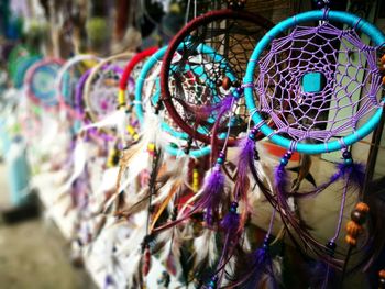 Close-up of multi colored dreamcatchers for sale at market stall